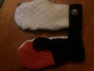 Sweater mittens, orange, black and off white. lined with fleece