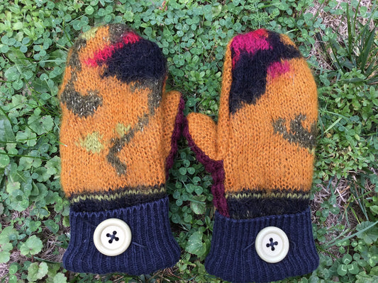 Handmade mittens from recycled sweaters. Multicolor with gold, mauve, black and green. Palm side is gold, black and mauve. Lined with fleece