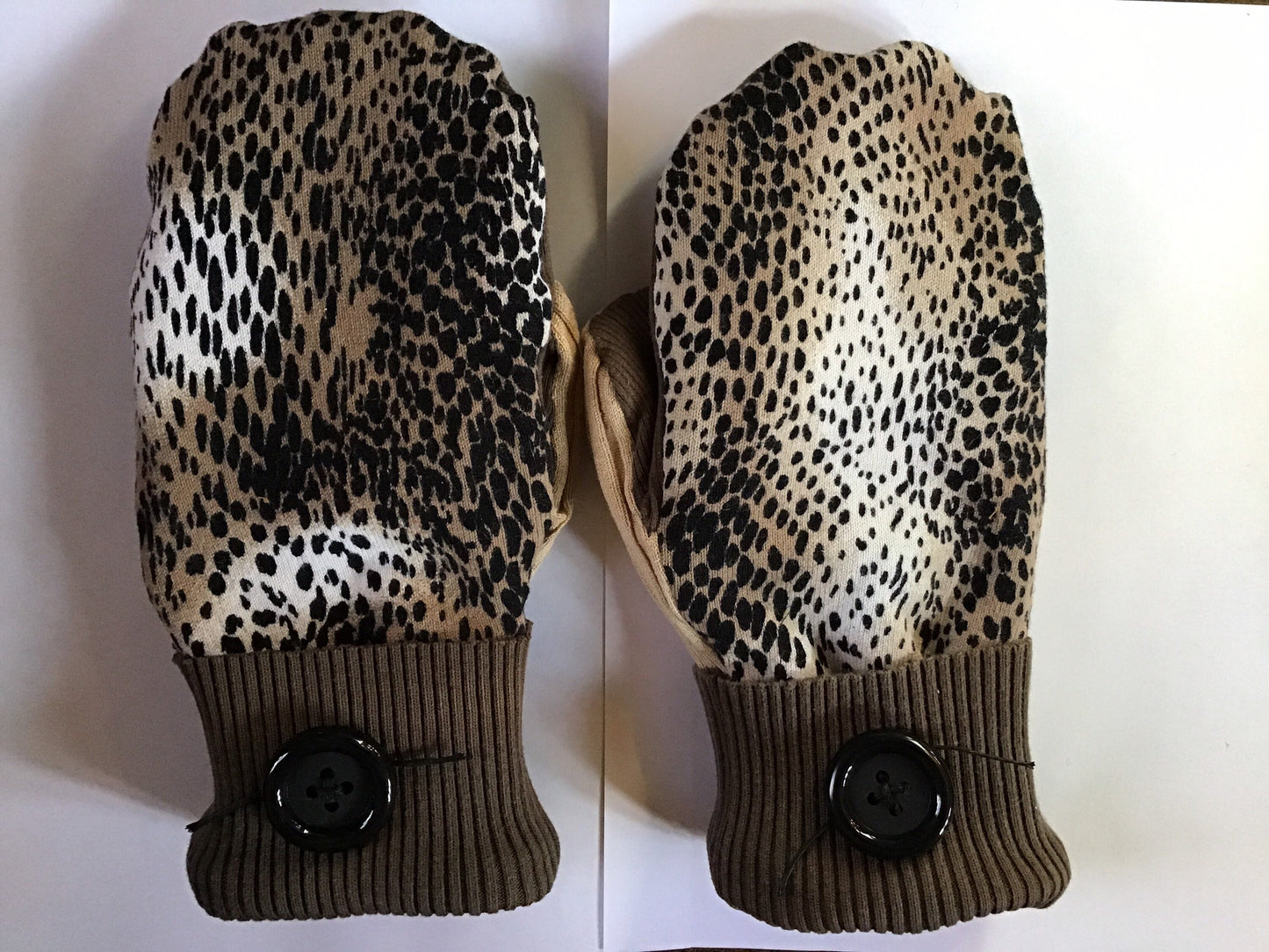 Handmade mittens from sweaters in leopard print and browns.